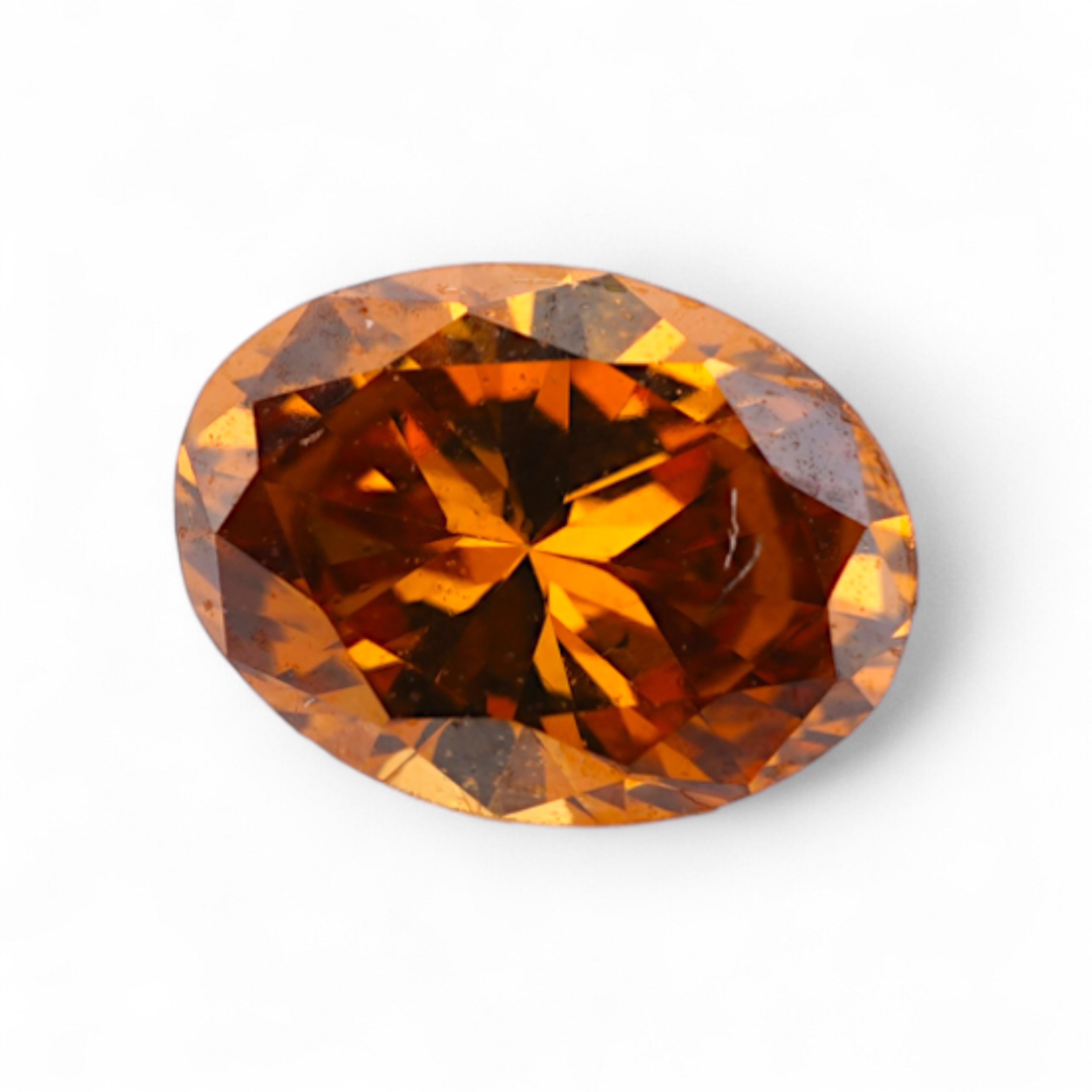 An unmounted Fancy Deep Brown-Orange diamond, the oval natural diamond measuring 5.3 x 3.9 x 2.5mm, with treated colour, weighing 0.34 carats, Accompanied by GIA report no. 6233434030, stating that the Fancy Deep Brown-O